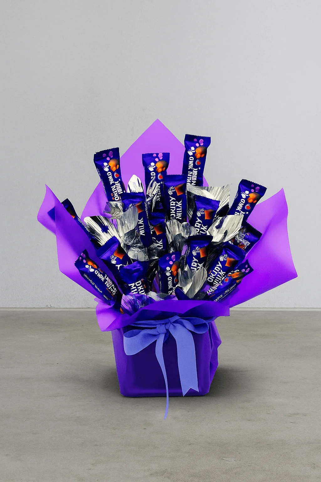 Mini Cadbury Dairy Milk Chocolate Arrangement in Purple Vase